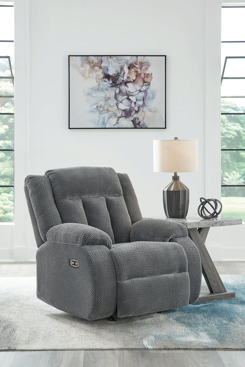 Ashley Furniture Observation Power Recliner in dark fabric, showing the closed reclined position with plush cushioning and armrests