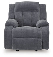 Ashley Furniture Observation Power Recliner showing plush gray upholstery and padded armrests, designed for comfort and support.