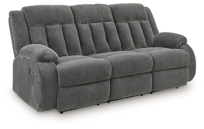 Ashley Furniture observation power reclining sofa with drop-down table, featuring plush cushions and built-in cup holders.