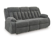 Ashley Furniture observation power reclining sofa with drop-down table, featuring plush cushions and built-in cup holders.