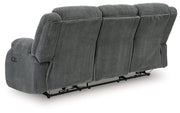 Ashley Furniture observation power reclining sofa with drop-down table, shown from the back with plush cushions and built-in features.