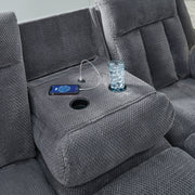 Ashley Furniture observation power reclining sofa with drop-down table and USB ports, featuring plush cushions and dark upholstery.