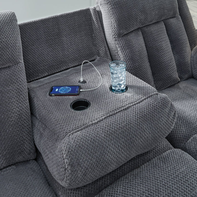 Ashley Furniture observation power reclining sofa with drop-down table and USB ports, featuring plush cushions and dark upholstery.