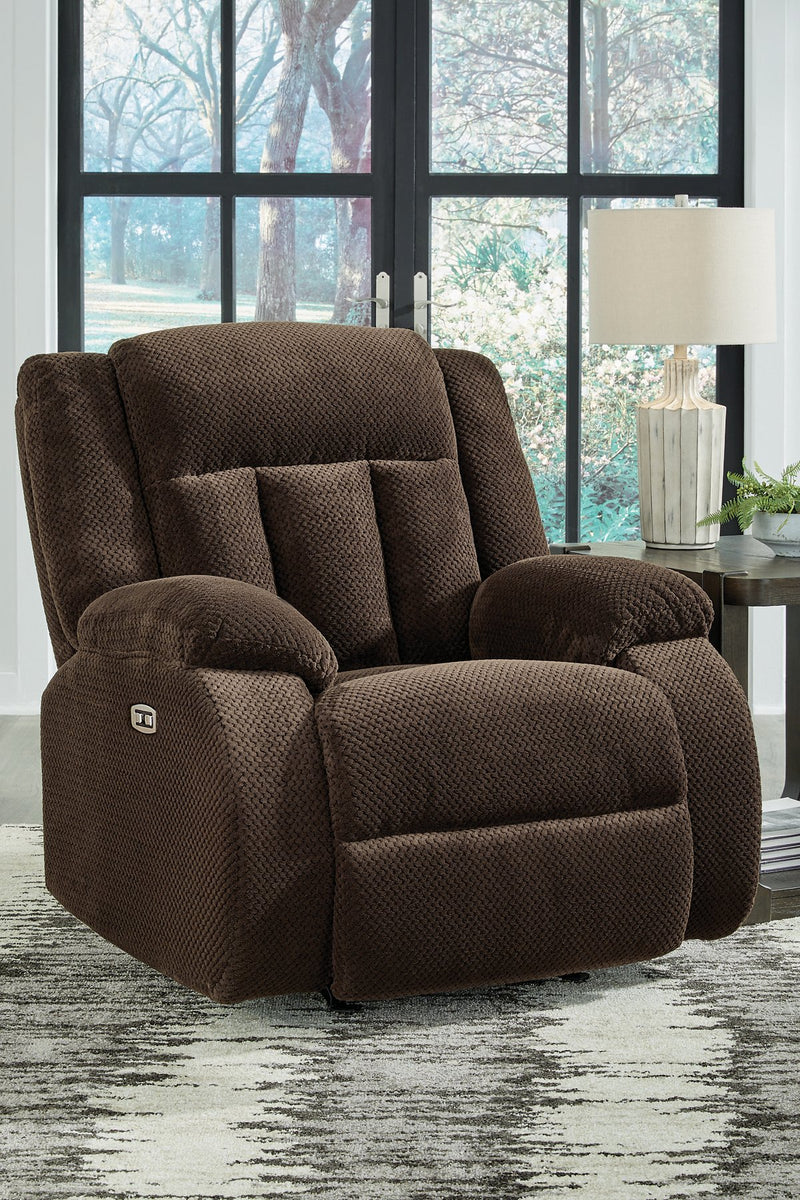 Close-up of Ashley Furniture Observation Power Recliner showing the plush fabric upholstery and built-in reclining mechanism.