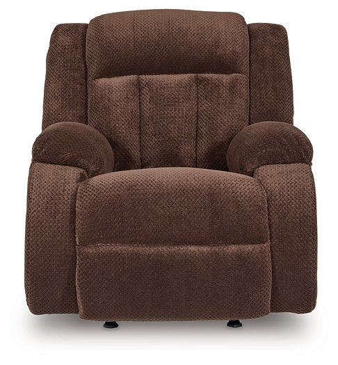 Ashley Furniture Observation Power Recliner showing plush fabric, padded armrests, and reclining mechanism in a living room setting.