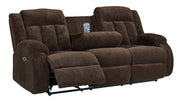 Ashley Furniture observation power reclining sofa with drop-down table, showing open position and plush seating in a modern living room.