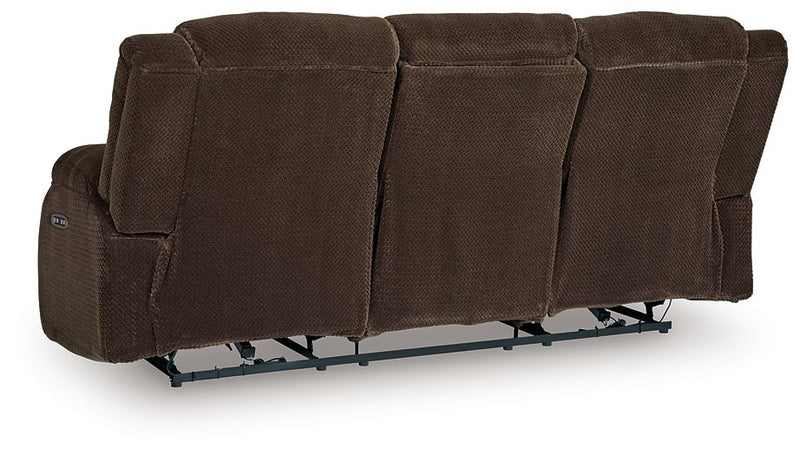 Ashley Furniture observation power reclining sofa with drop-down table, featuring plush cushions and built-in cup holders.