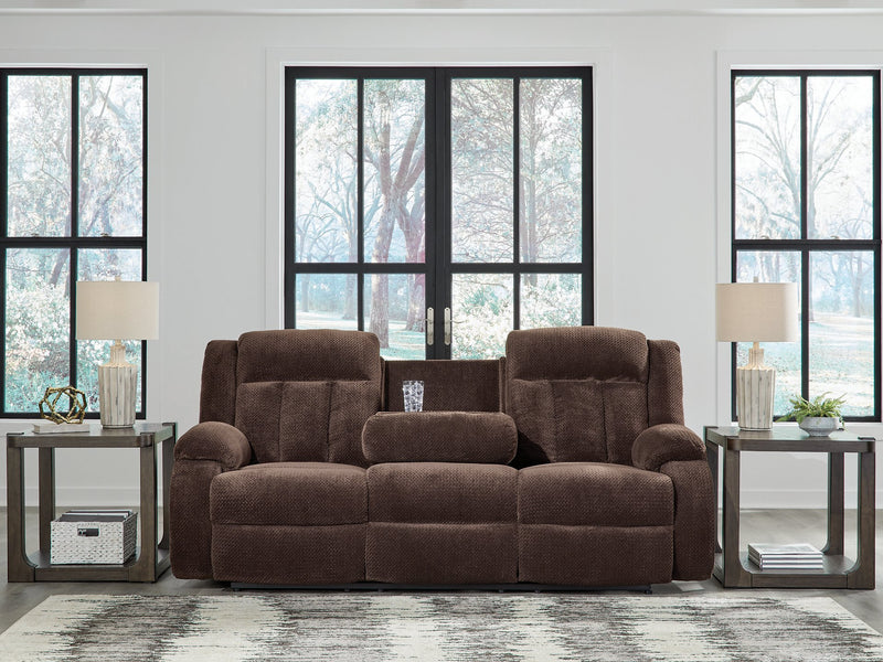 Ashley Furniture observation power reclining sofa with drop-down table, showing plush upholstery and built-in cup holders.