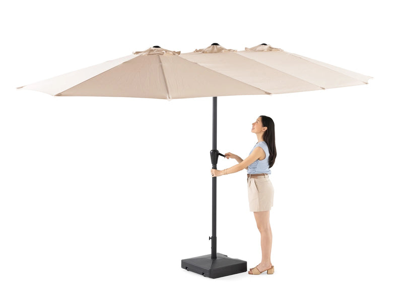 Transformer Table outdoor patio umbrella with a round canopy, shown closed in a neutral color