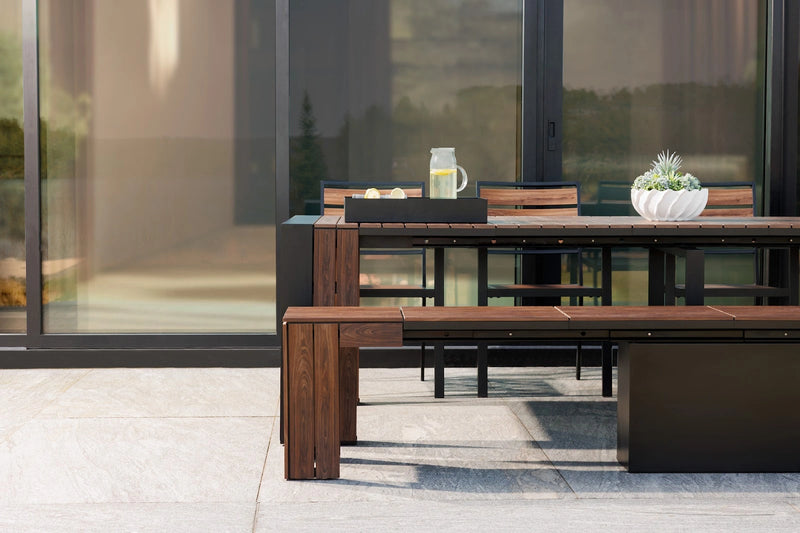 Transformer Table outdoor dining table by Transformer Table, shown in a backyard setting