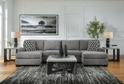 Ashley Furniture Birkdale Court sectional sofa with plush cushions and neutral upholstery, shown in a modern living room setting.