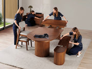 Transformer Table Eclipse dining table in a modern expandable design, shown in a warm wood finish