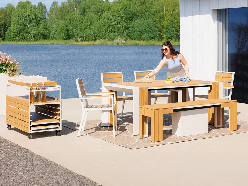Transformer Table outdoor dining set with expandable table and matching benches on a patio