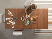 Transformer Table dining table shown in its compact configuration with a modern wood finish