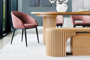 Transformer Table round dining table in a modern wood finish, shown with a compact design
