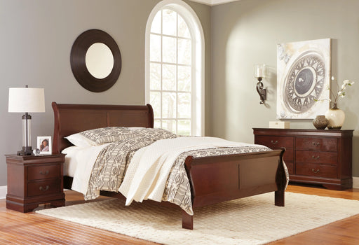 Ashley Furniture Alisdair bedroom set featuring a wooden bed frame, matching nightstands, and dresser in a modern design.