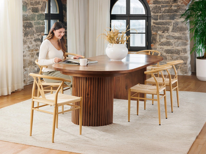 Transformer Table round dining table in a modern wood finish, shown fully assembled