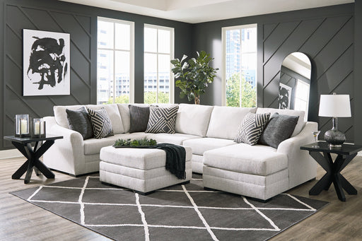 Ashley Furniture Koralynn living room set with a plush sofa and matching armchair in a modern design, beige upholstery, and wooden legs.