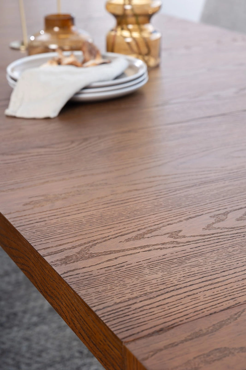 Transformer Table extendable dining table in natural wood finish, shown folded compactly.