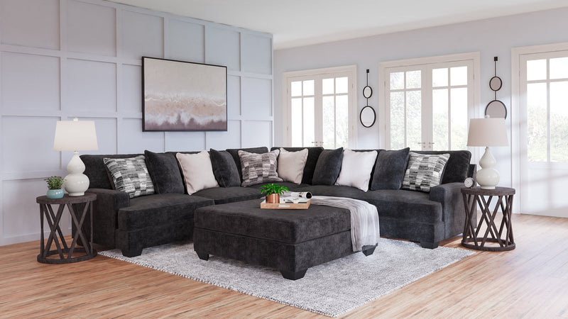 Ashley Furniture Lavernett living room set with sofa and armchair featuring beige upholstery and wooden legs.