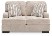 Ashley Furniture high profile loveseat with plush upholstery, shown from a front head-on view highlighting its stylish design.