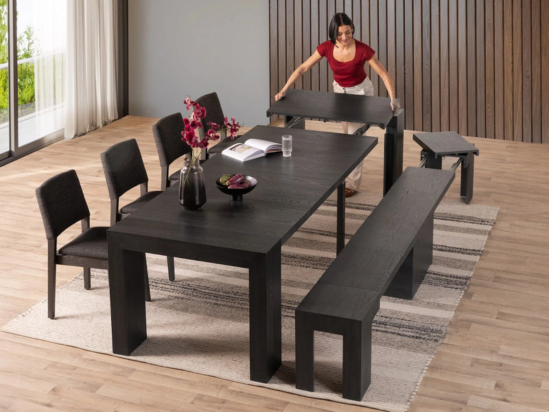 Transformer Table dining set with expandable dining table and matching chairs in a modern room