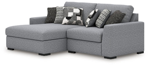 Ashley Furniture Bealton sectional with chaise, showing a modern L-shaped sofa with plush cushions and fabric upholstery.