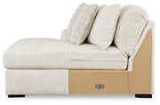 Ashley Furniture Chessington sectional with double chaise, featuring plush cushions and contemporary design in a neutral fabric.