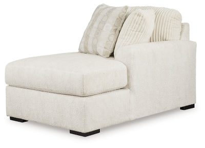 Ashley Furniture Chessington sectional with double chaise, showing the L-shaped design and plush fabric upholstery from an angled view.