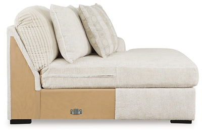 Ashley Furniture Chessington sectional with double chaise, featuring plush upholstery and modern design, shown from the side.