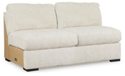 Ashley Furniture Chessington sectional with double chaise, featuring plush cushions and modern design, shown from an angled side view.