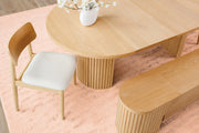 Transformer Table round dining table with a modern wood finish, shown in a compact configuration