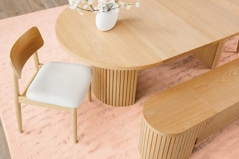 Transformer Table round dining table with a modern wood finish, shown in a compact configuration
