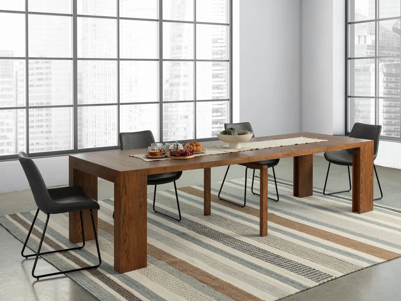 Transformer Table dining table shown in its extended configuration with a modern wood finish