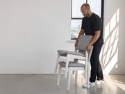 Transformer Table dining chair in a modern design, shown from the side against a neutral background