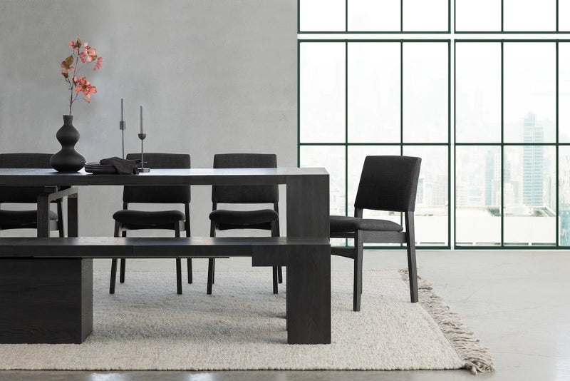 Transformer Table dining set with expandable table and matching chairs in a modern dining room