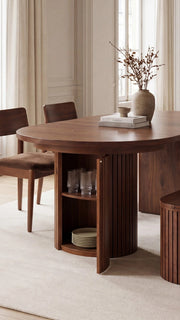 Transformer Table round dining set with extendable round table and matching chairs in a modern dining room