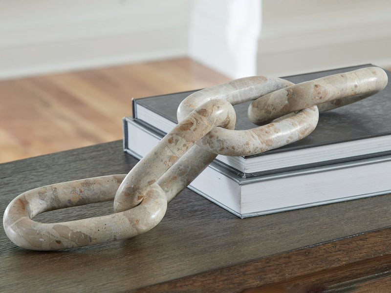 Ashley Furniture Kenport Sculpture, modern decorative sculpture with sleek design, shown in a close-up view.