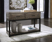Ashley Furniture Johurst sofa table with a sleek wooden top and sturdy legs, ideal for living room decor.