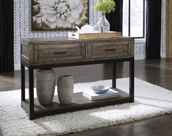 Ashley Furniture Johurst sofa table with a sleek wooden top and sturdy legs, ideal for living room decor.