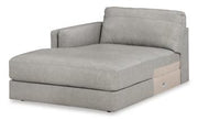 Ashley Furniture Amiata sectional with chaise, showing a modern fabric sofa with a spacious chaise lounge for comfortable seating.