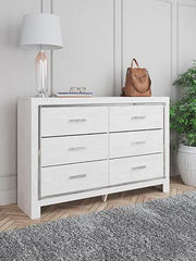 Modern Ashley Furniture Altyra Dresser with sleek drawers and contemporary design, shown in a well-lit bedroom setting.