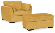 Ashley Furniture Keerwick living room set featuring a sofa, loveseat, and armchair with plush upholstery and coordinating design.