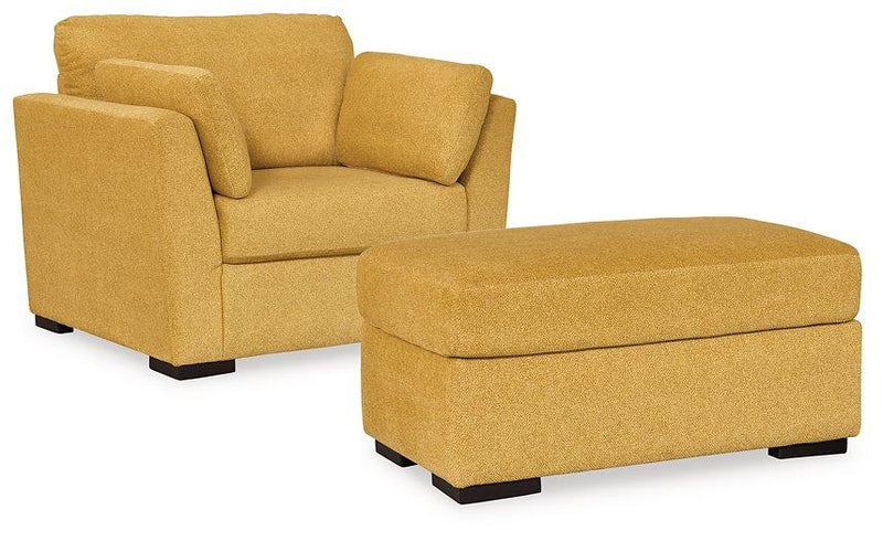 Ashley Furniture Keerwick living room set featuring a sofa, loveseat, and armchair with plush upholstery and coordinating design.