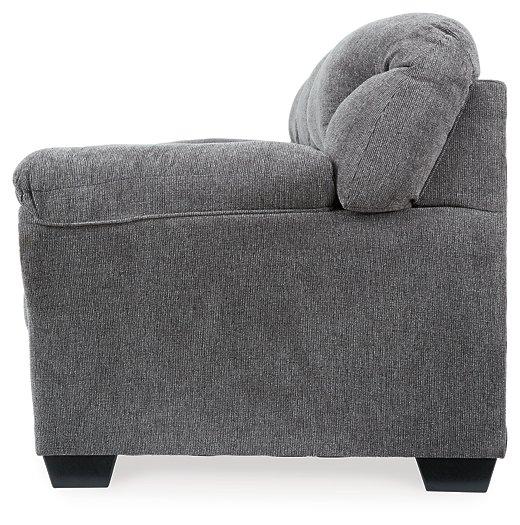 Ashley Furniture Allmaxx sofa with plush cushions and modern design, shown in a stylish living room setting.