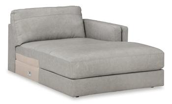 Ashley Furniture Amiata sectional with chaise, showing plush fabric, modern design, and spacious seating arrangement.