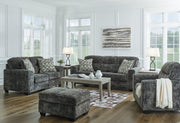Ashley Furniture Lonoke living room set with sofa and armchair, featuring neutral upholstery and modern design.
