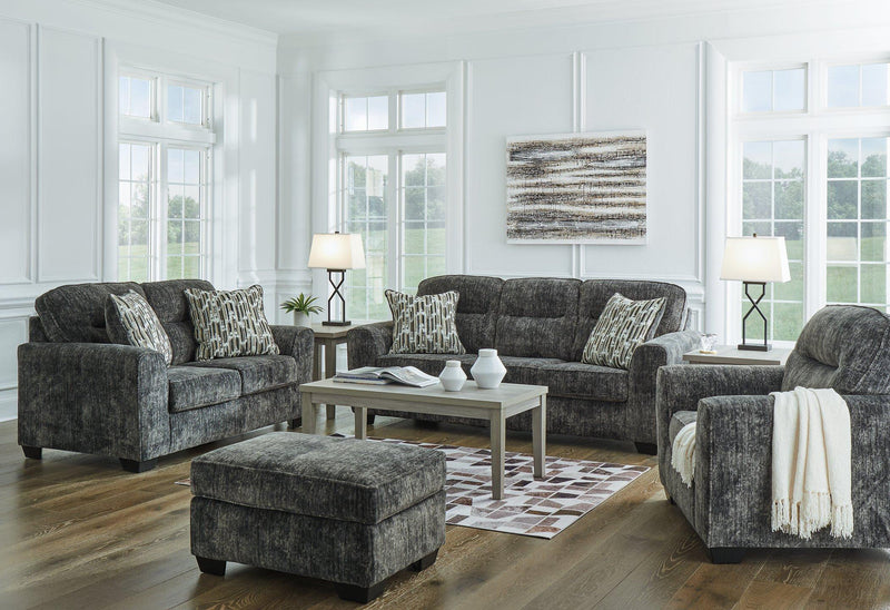 Ashley Furniture Lonoke living room set with sofa and armchair, featuring neutral upholstery and modern design.