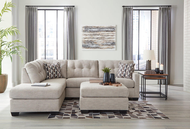 Ashley Furniture Mahoney living room set with sofa, loveseat, and coffee table arranged in a modern living space.