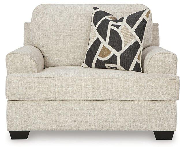Ashley Furniture Heartcort living room set with a sofa and armchair, featuring plush upholstery and modern design.